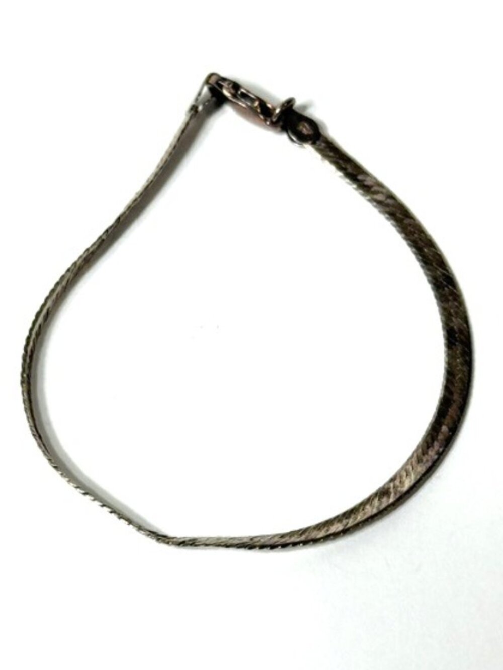 Sterling silver 7 1/2" herringbone bracelet that says "Someone Special".